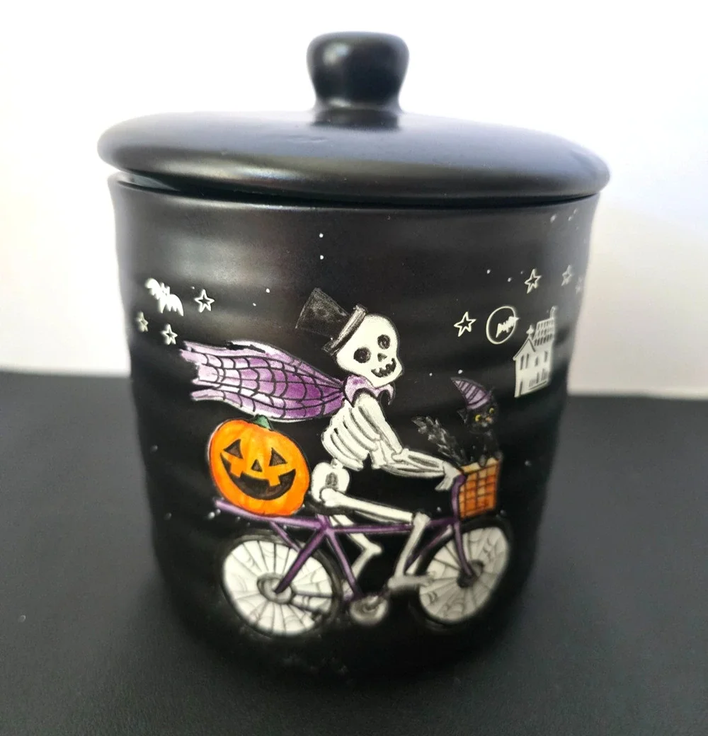 Cobwebs & Cauldrons Skeleton on Bike with Jack-O-Lantern 5 1/2